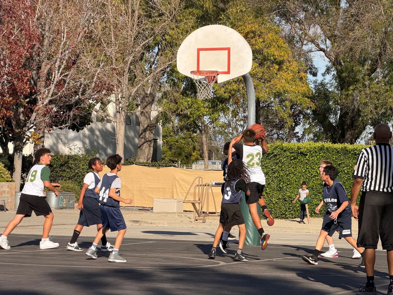 Carden Arbor View students playing basketball after school